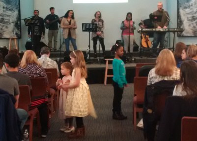 kids taking offering crop